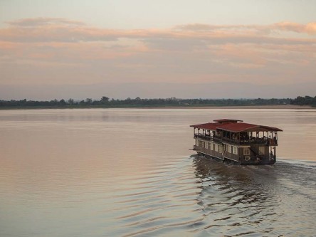 The Vat Phou boat, a floating hotel cruising on the Mekong River, Southern Laos